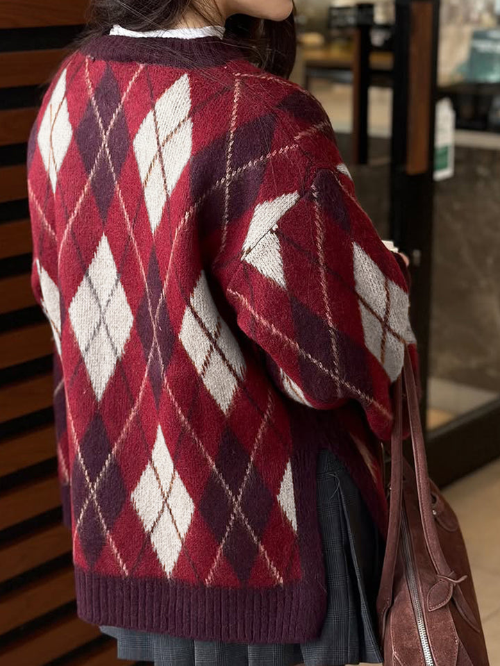 Person wearing a red and white argyle sweater in an indoor setting