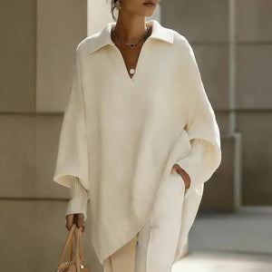 Person wearing a white poncho with a blurred background