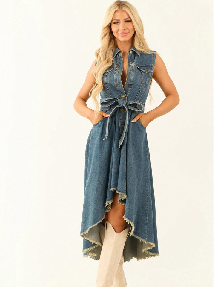 Woman wearing a denim dress with a white background