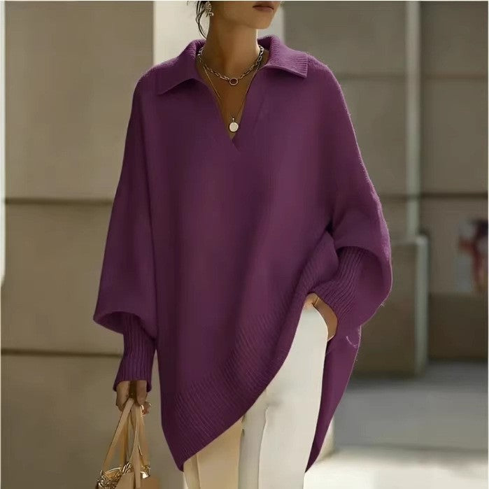 Person wearing a purple sweater with a blurred background