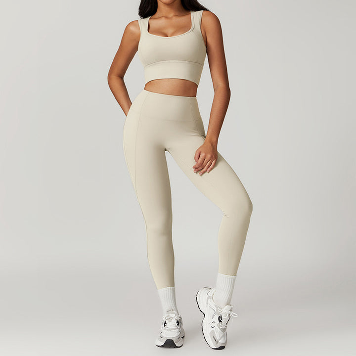 Person wearing a beige athletic outfit on a plain background