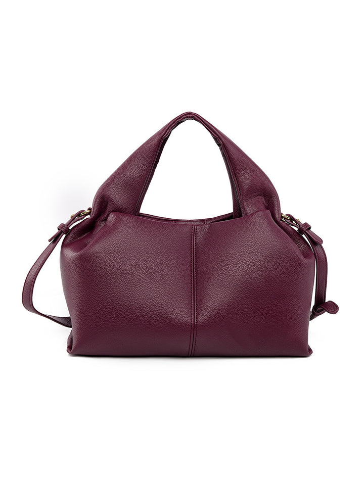 Burgundy leather handbag on a white background