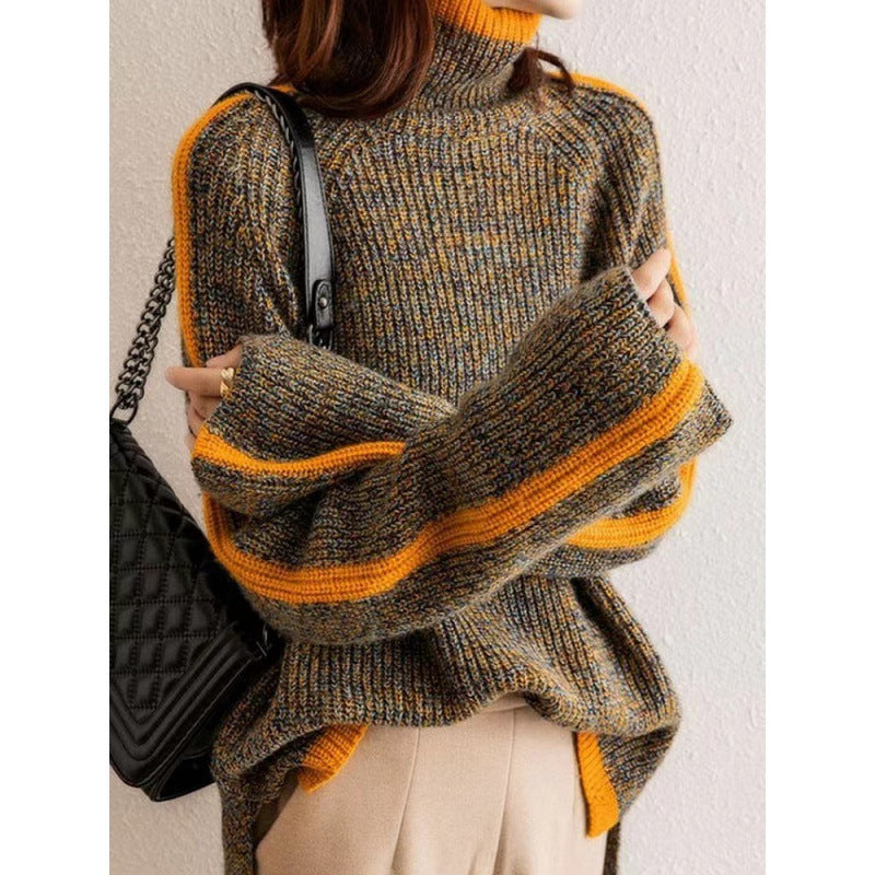 Person wearing a brown and orange sweater with a black handbag.