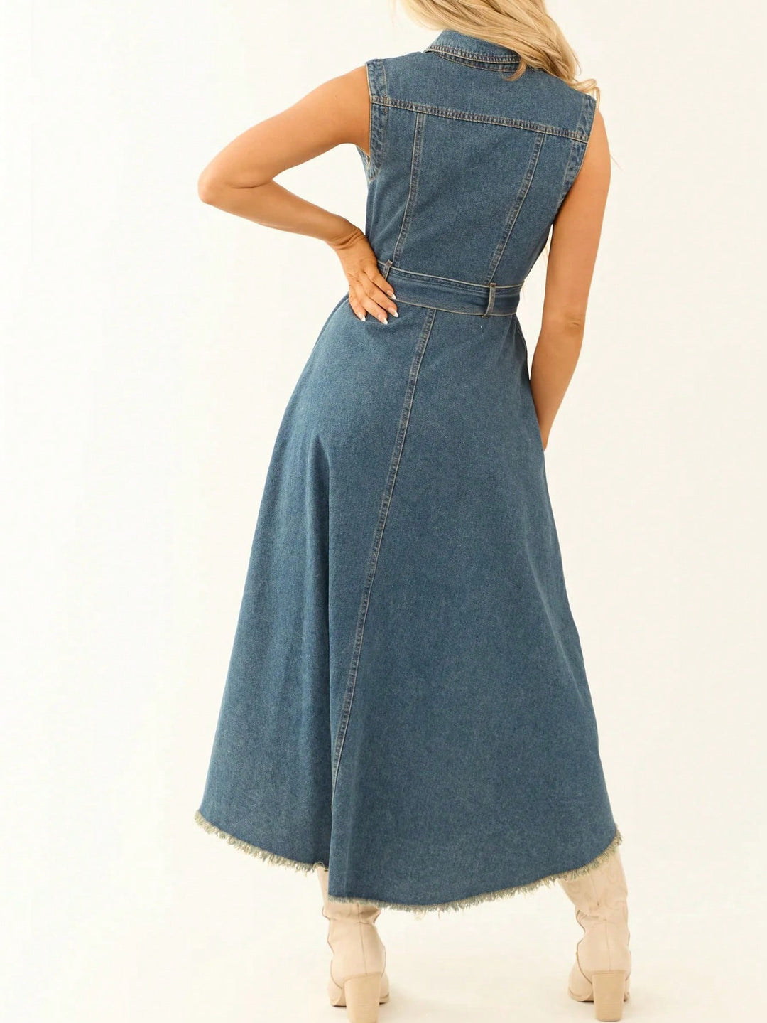 Woman wearing a denim dress on a white background