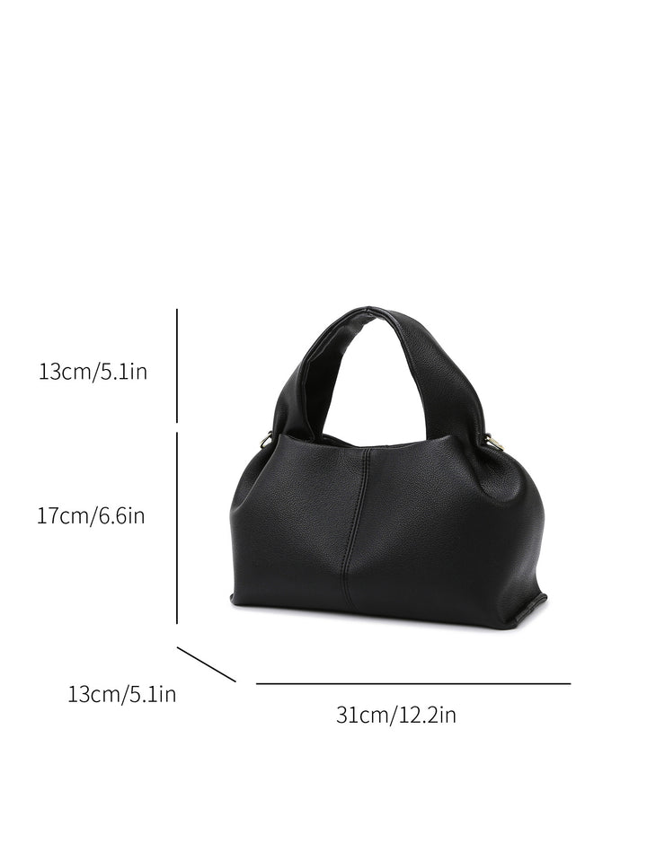 Black handbag with dimensions indicated on a white background