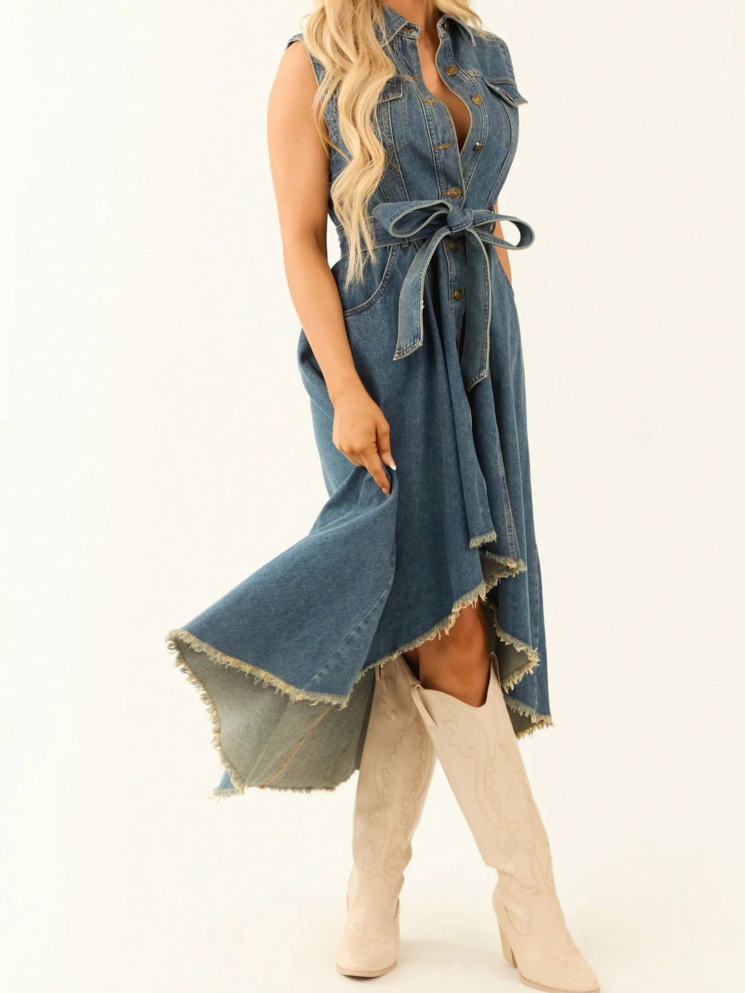 Denim dress with a belt worn by a person on a white background