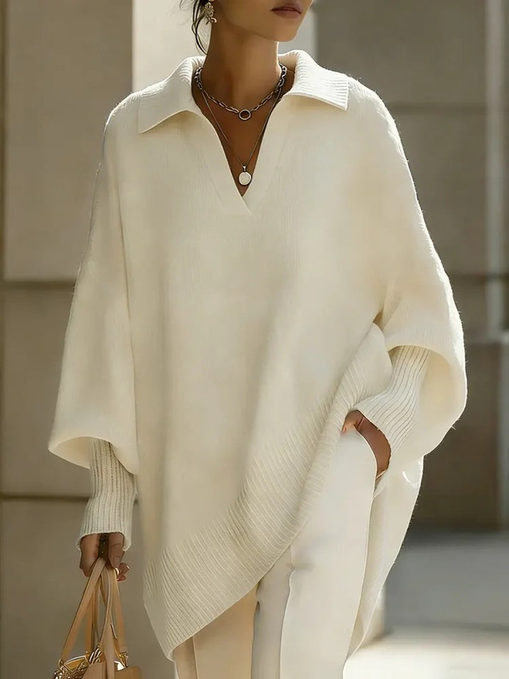 Person wearing a white poncho with a blurred background