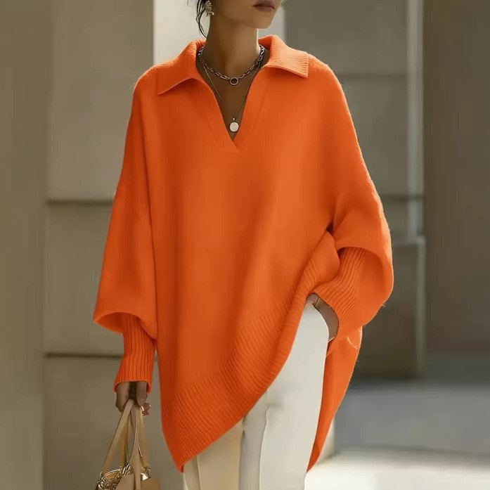 Person wearing an orange poncho with a blurred background
