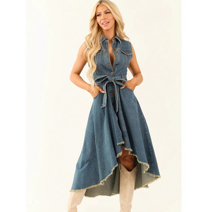 Woman wearing a denim dress with a white background